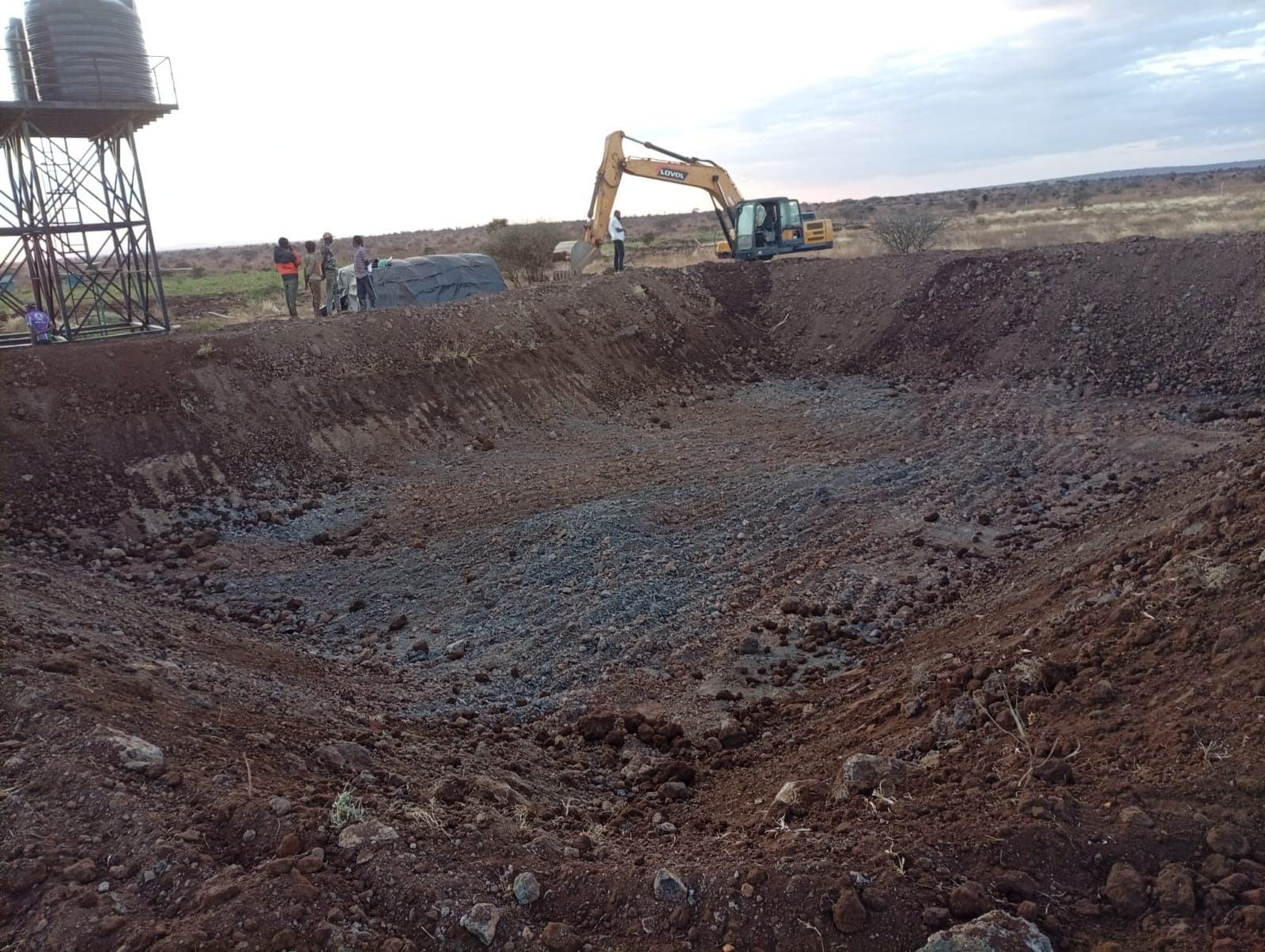 Excavator working a dam excavation from a different angle