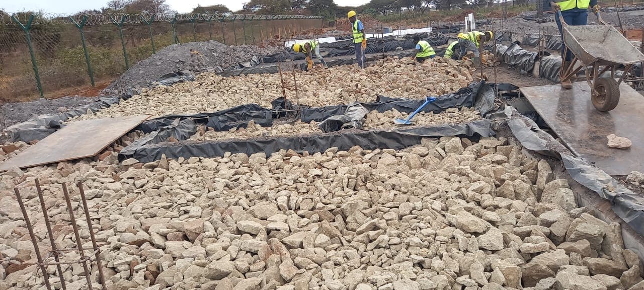 Hardcore rubble packed into foundation trenches
