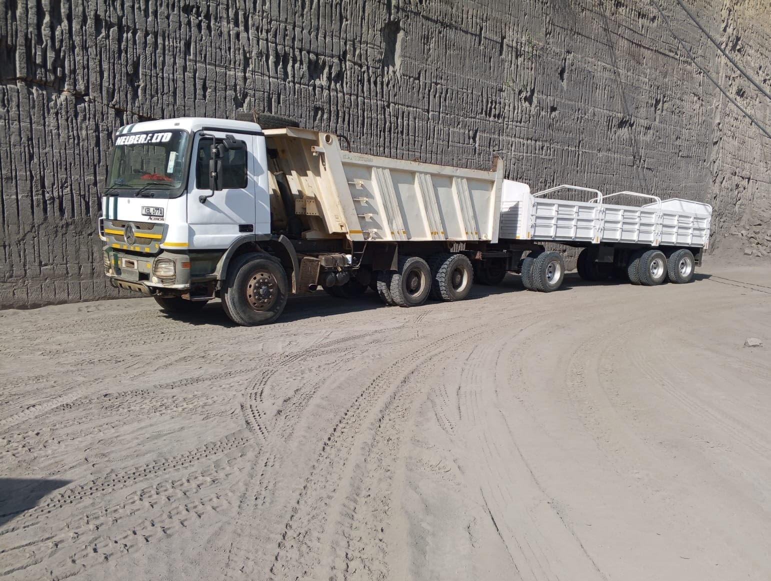 Nelber tipper and drawbar trailer hauling hardcore from the quarry