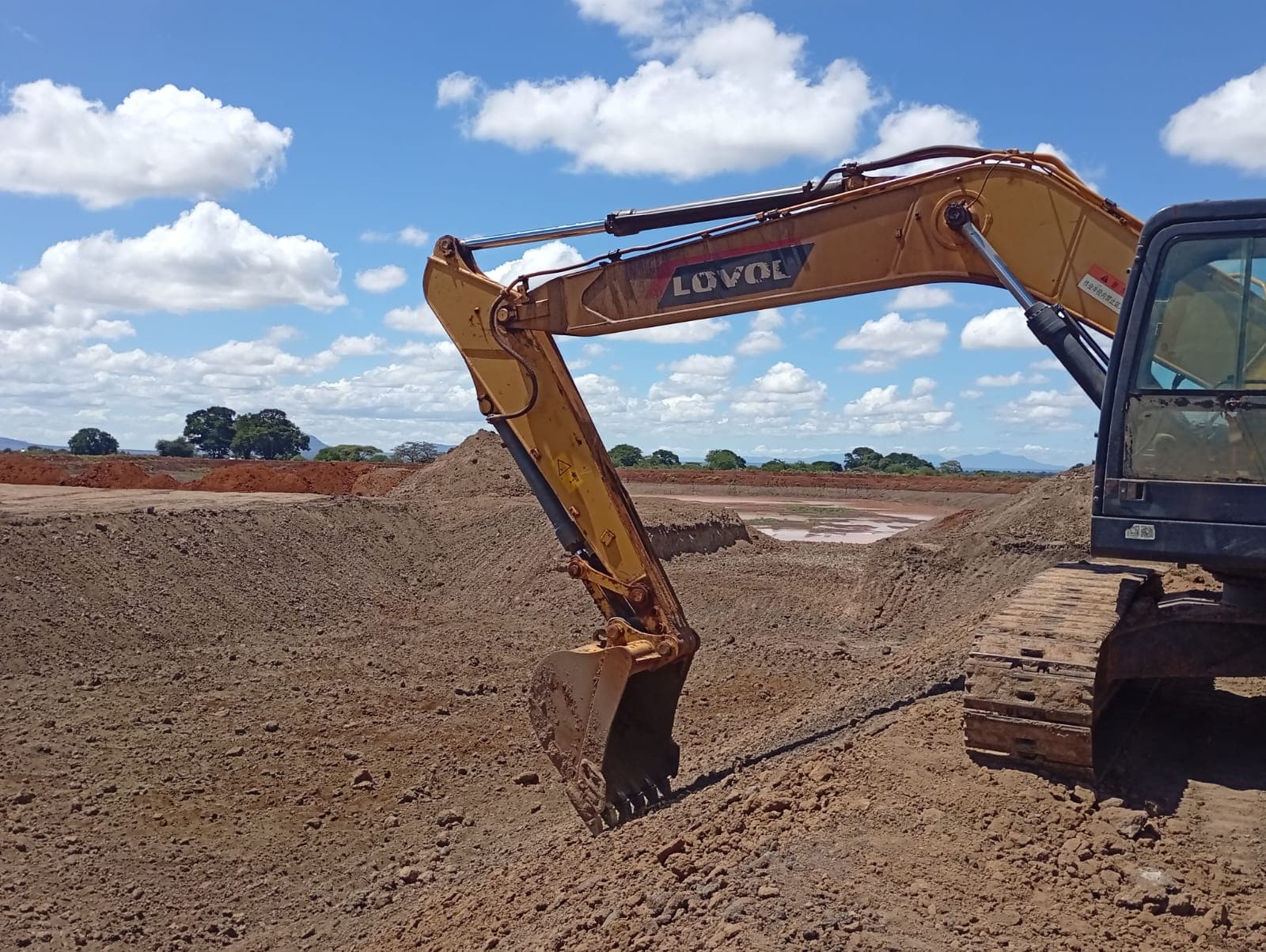Dam earthworks and shaping